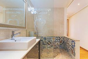Walk-in shower with mosaic tiling