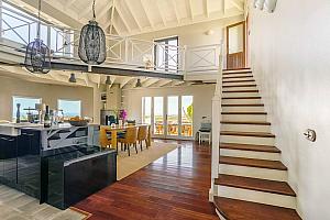 Kitchen dining room with stairs to mezzanine
