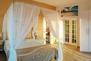 Four poster bed with curtains