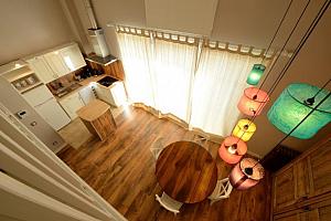 Duplex room with living area and kitchen