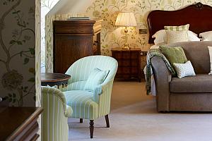 Suite in the roof with sofa and chairs