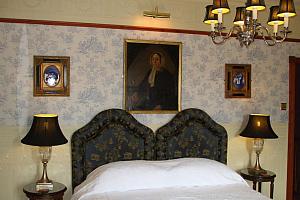 Bedroom with paintings, chandalier