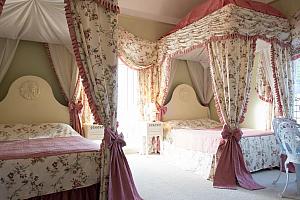 Two four poster beds