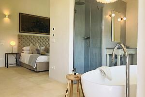 Bedroom with big bathtub